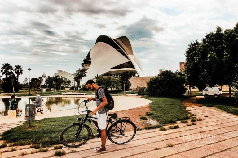 The view of the city of Arts and Science of Valencia discovering the Turia Gardens by bike