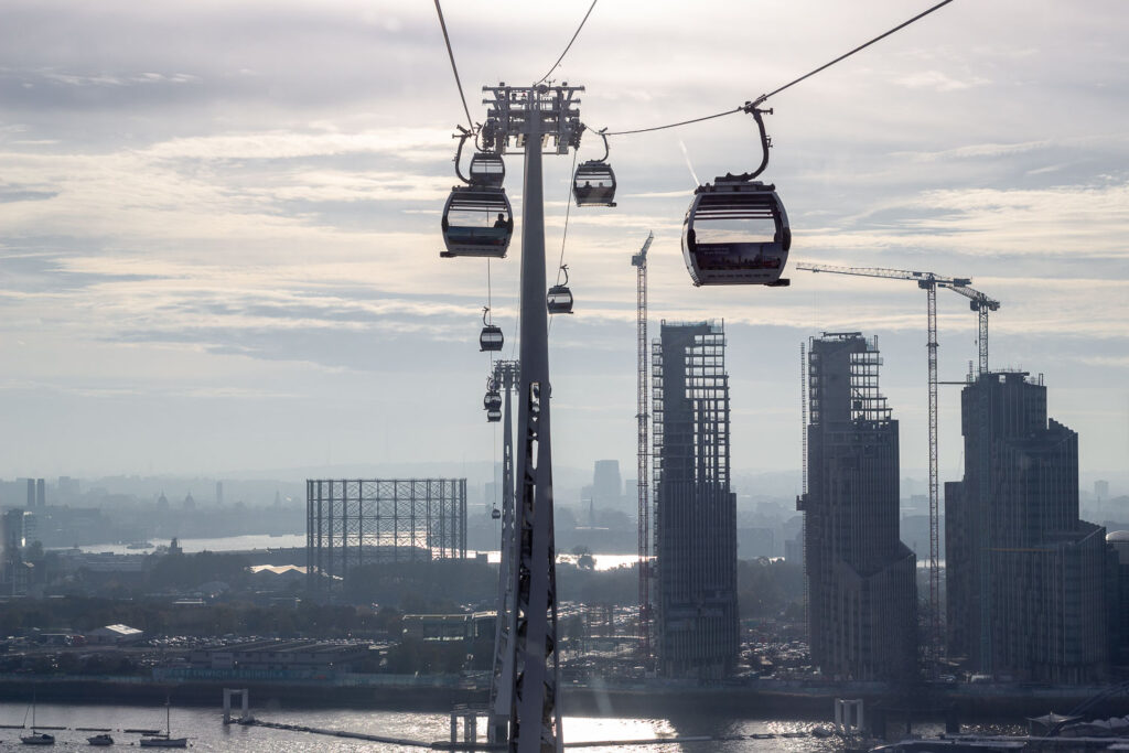15 Things to do in a day out in Greenwich, London 10 The view of the cabins of cable car going approaching the other bank or river thames