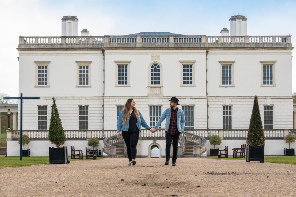 A beautiful image of a couple walking from the Queen's house in Greenwich Park Queen's House Greenwich day out