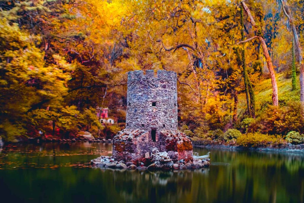 Weekend breaks in Portugal | 10 Perfect locations to visit in Portugal 5 The beautiful tower in the lake in te Sintra Pena Palace Garden