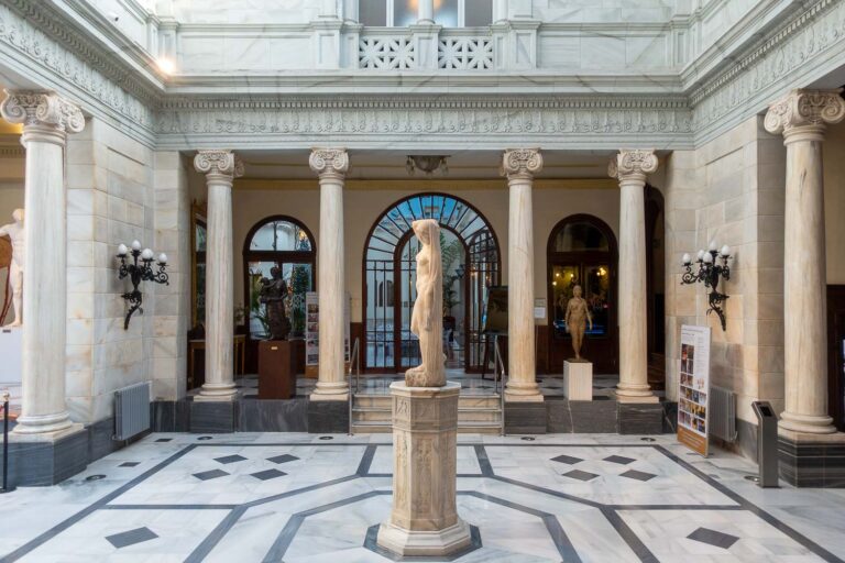Casino of Murcia intern courtyard , statue and majolicas