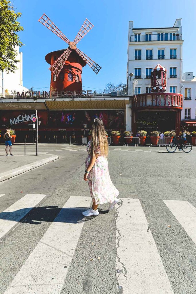 Bimba crossing the street and admiring the beautiful Moulin Rouge