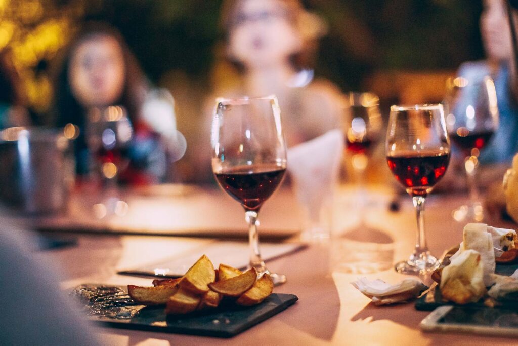 A traditional Italian dinner with red wine - Top Italian wines to try