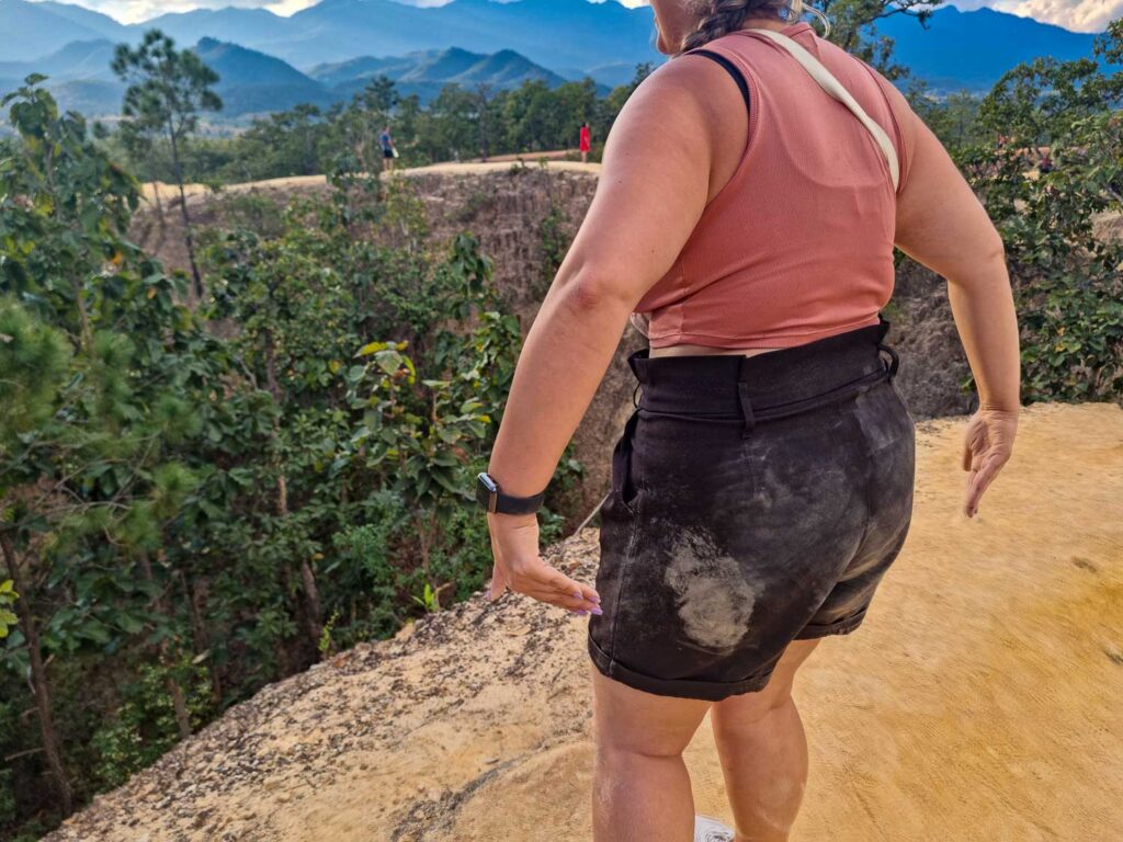 Exploring Pai Canyon in Thailand: A Guide to the Most Stunning Natural Wonder 7 You will get dusty and dirt after exploring Pai Canyon. The red and yellow dust will cover your clothes