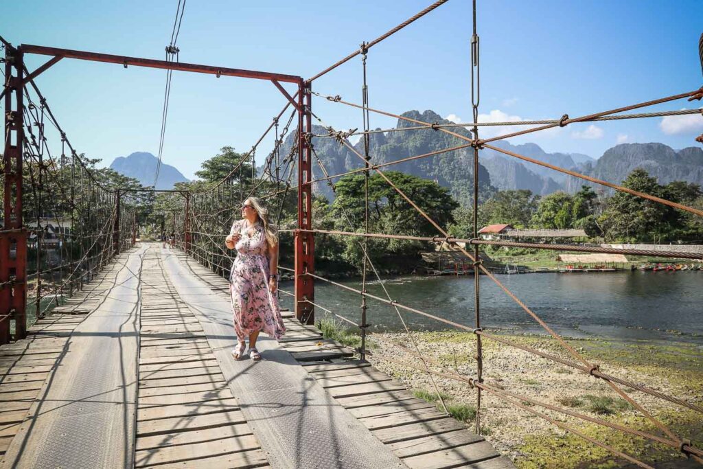 Is Worth Visiting Vang Vieng: 8 Reasons why visitng Vang Vieng and have an unforgettable adventure 8 Bamboo bridge that connect Vang Vieng city to the countryside, you can cross it by scooter or walking. It is very unstable but never gave problems to us