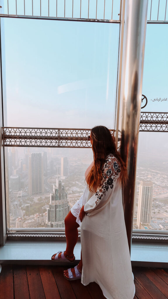 The View from Burj Khalifa - Bimba overlooking the stunning view - Insatgrammable places in Dubai