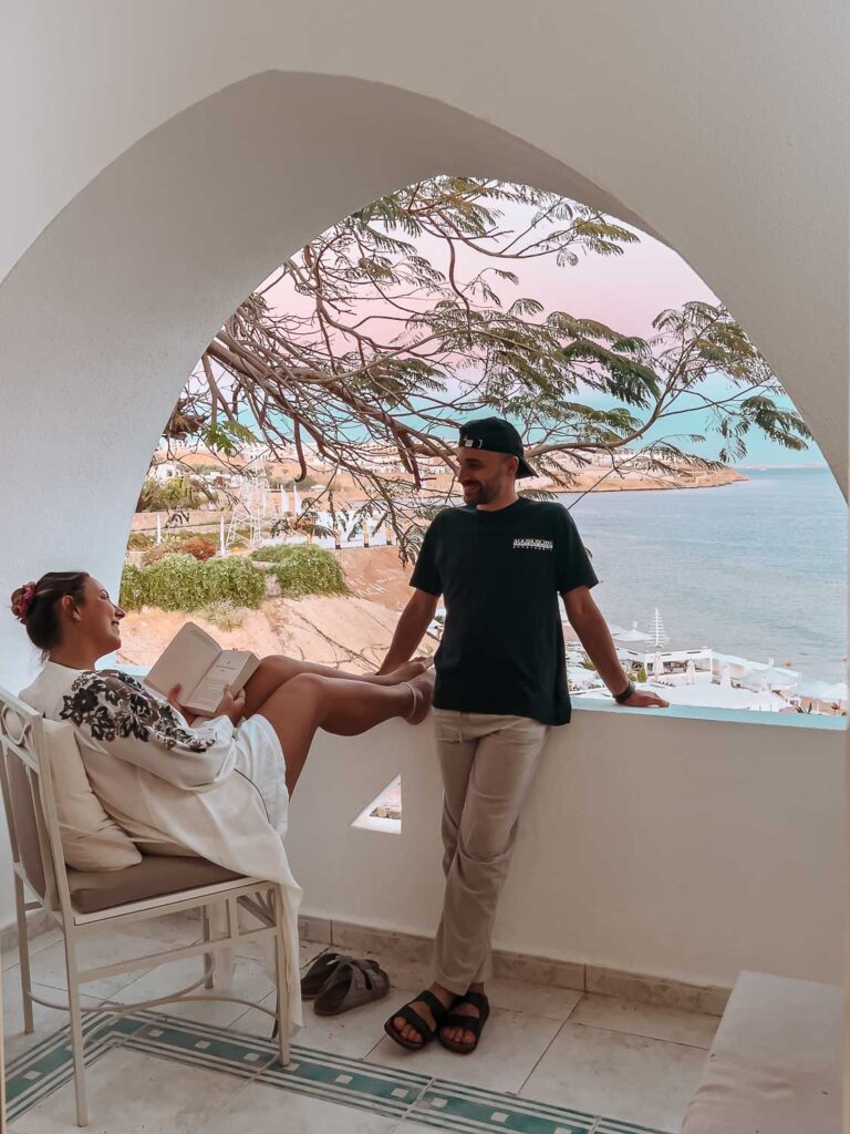 Toti and Ale sitting on the balcony at Domina Coral Bay Resort
